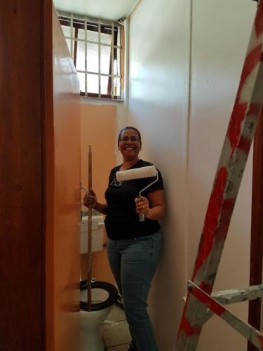 Charmaine painting teachers bathrooms